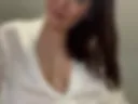 A dildo rider from behind in a white robe