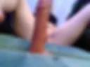 I caress the dildo with my feet in oil