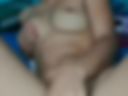 Young girl on the edge of the bed, fucking a dildo full of cum video recorded from a cell phone