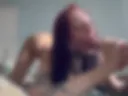 Suck a dildo on the bed