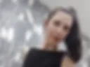 Your kitty, in a little black dress and stockings, plays with her naked pussy