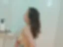 Marusya washes in the shower