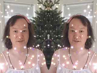 I'm in white and with lights by the tree
