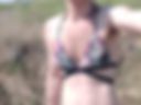 In a swimsuit across the field