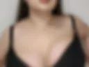 Breast play in a black bra