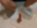 I stroke a dildo with my blue socked feet and show off my little penis.
