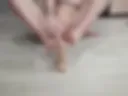He's wanking with his feet