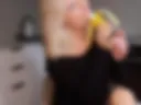 Sucking on a banana