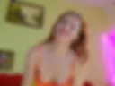 in orange lingerie and thongs open nylon legs wide in stockings