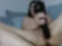 Playing with a big black dildo