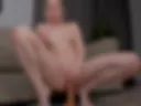 Riding a dildo with pussy and anal