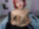 Redheaded goth gives you a striptease