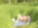 I'm playing with a dildo in a public park, and people are walking by.
