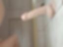Nurse plays with a dildo at home after work