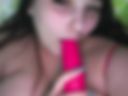 I suck on a dildo and insert it into myself.