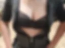 in a black bra and dress