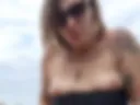 Hot squirt at public beach with buttplug