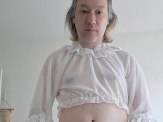 In white stockings and a white blouse without panties