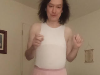 In a pink skirt and bodysuit