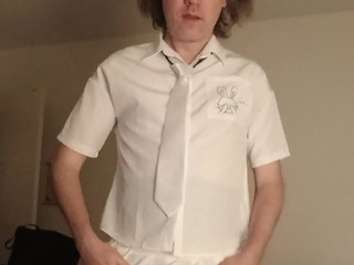 In dark tights, a white skirt and blouse