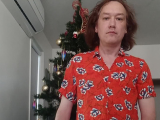 By the New Year tree in a red shirt