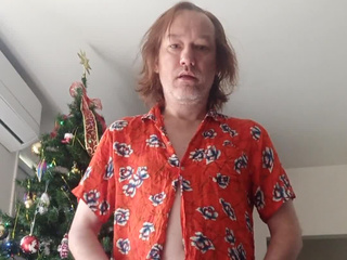 Near the New Year tree in one red shirt