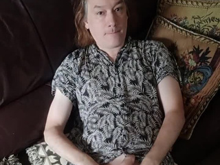 Lying in just a shirt, I cum on my tummy