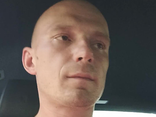 I'm smoking in the car with a cigarette.